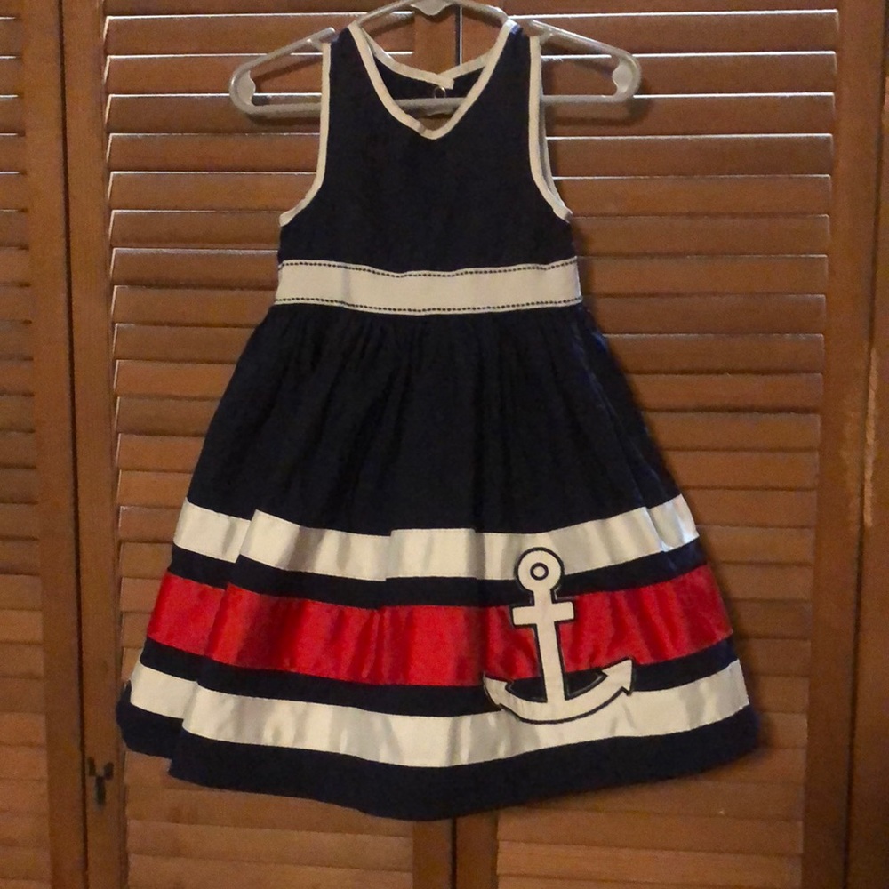 Nautical toddler girls dress navy color with red and white trim. Used